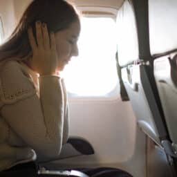 Woman Suffering From Airplane Ear